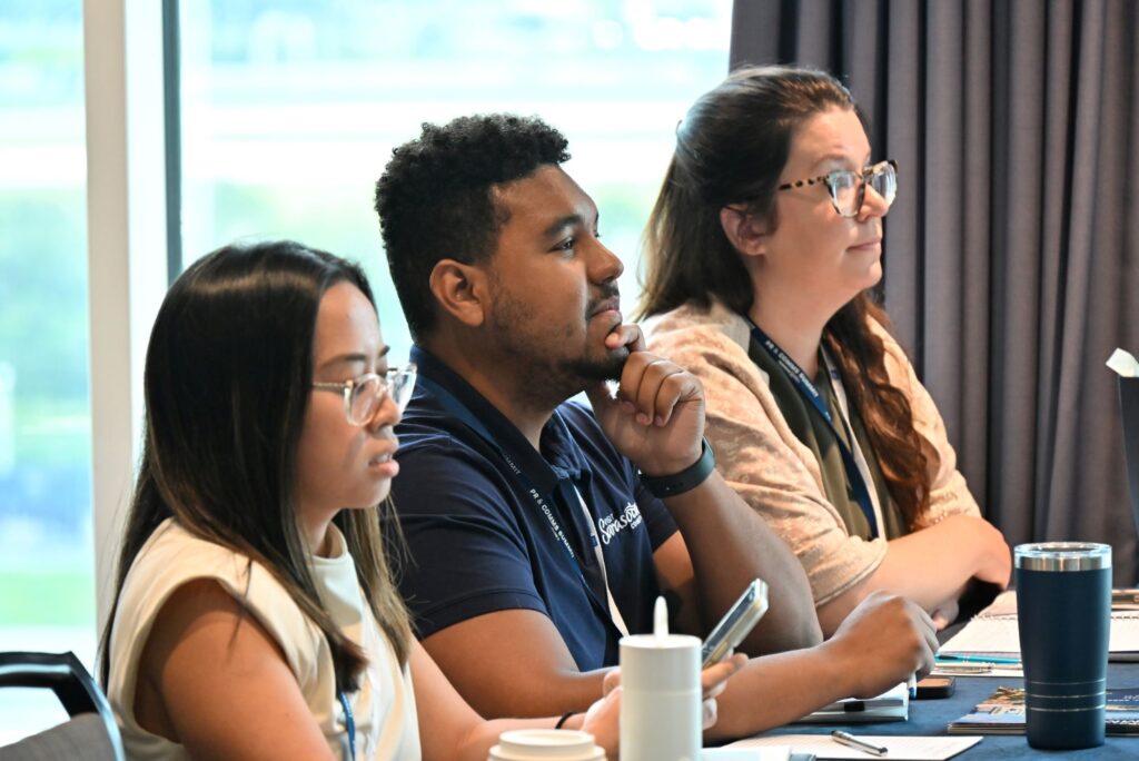 CWC-FPRA members Jodel Velarde, Nate Sweetman, and Kaylea Schule attending a session during the 2024 PR & Comms Summit